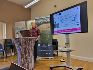 John Holland giving presentation