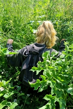 Maddie climbing through a ditch
